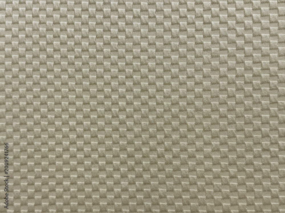 Fototapeta premium Close up of silver grey fabric in checkerboard or checkered pattern, square and rectangular pattern. Seamless silver synthetic fabric background texture.