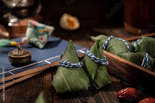 Traditional Zongzi Dumplings for Dragon Boat Festival on Rustic Wooden Table