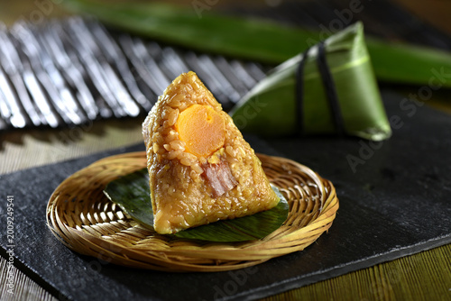 Chinese zongzi sticky rice dumpling with salted egg yolk and pork