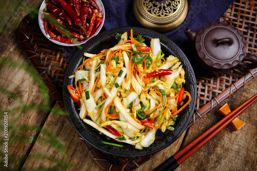 Bild auf Leinwand Spicy Cold Napa Cabbage Salad on Rustic Asian Table