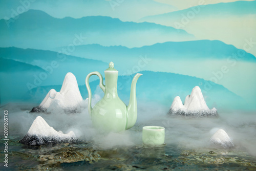 Canvastavla Serene celadon teapot and cup in misty zen mountain still life