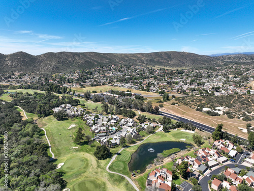 Aerial view of Ramona neighborhood with mountain, valley and San Vicente Golf Course, in California, USA