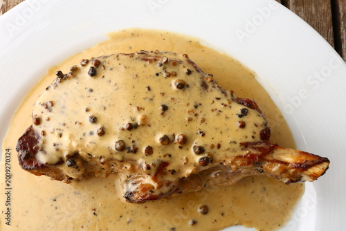 Φωτογραφία Entrecote Steak with Green Pepper Sauce on Plate