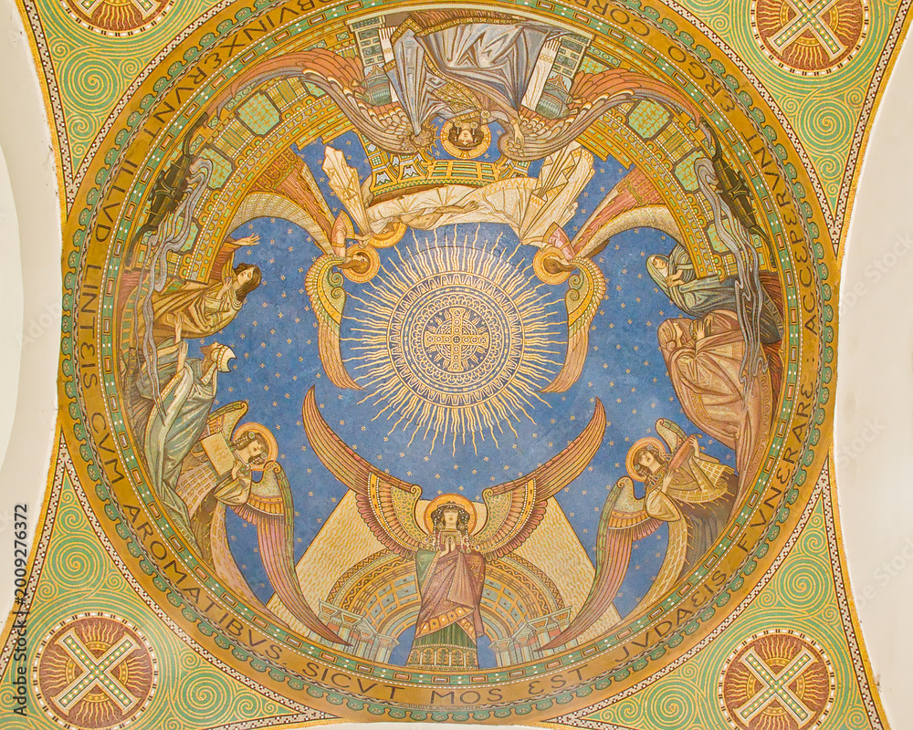 Obraz premium Colorful mosaic depicting heaven with a cross and angels and geometrical figures around. detail of the Arcade in Kerepesi, historical graveyard along Fiume Road in Budapest, Hungary