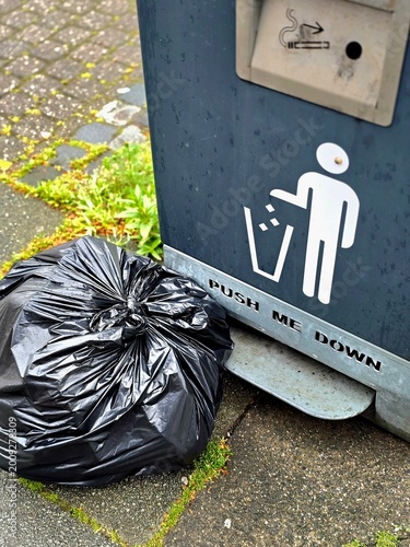 Keep Britain Tidy volunteer litter picking rubbish in UK park – environmental cleanup and community action