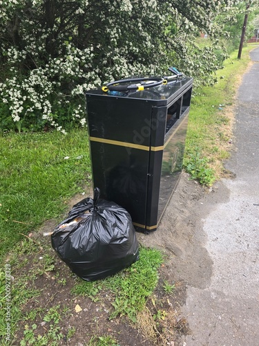 Keep Britain Tidy volunteer litter picking rubbish in UK park – environmental cleanup and community action