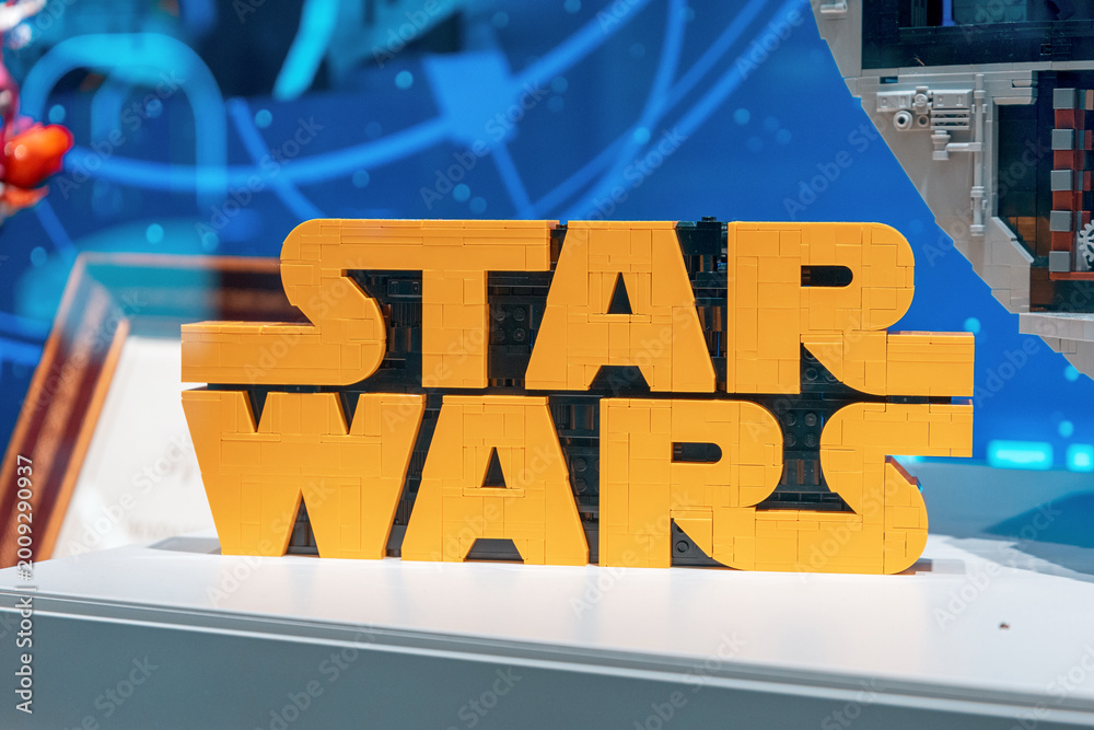 Naklejka premium 19 October 2025, Belgrade, Serbia: LEGO Star Wars logo with iconic yellow bricks representing the popular movie franchise and toy brand on display