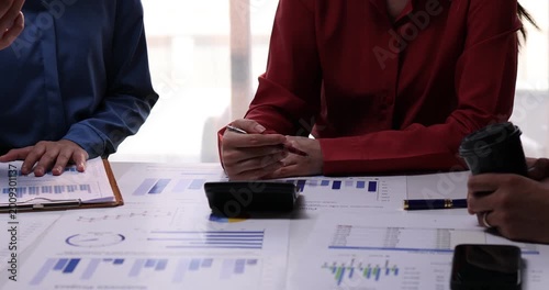 Analyze financial data and accounting record with calculator in meeting office, Accounting company charts and graphs banner, double exposure successful business finance and taxation planning concept.