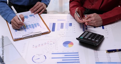 Analyze financial data and accounting record with calculator in meeting office, Accounting company charts and graphs banner, double exposure successful business finance and taxation planning concept.