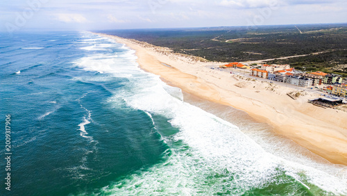 Panoramic coastal scene with turquoise waters and sandy beach
