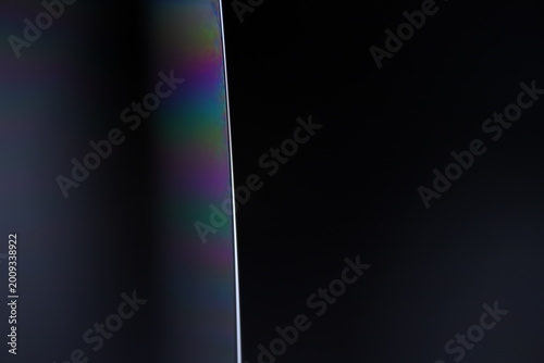Minimalist Macro of Sharp Glass Edge with Rainbow Prism Light Leak