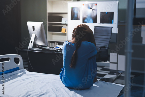 A patient with depression looks outside.