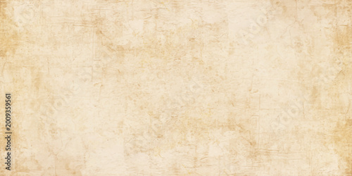 Vintage parchment paper background with aged texture, antique yellowish grunge surface for scrapbooking and design. weathered and distressed vintage paper texture. subtle stains, speckles