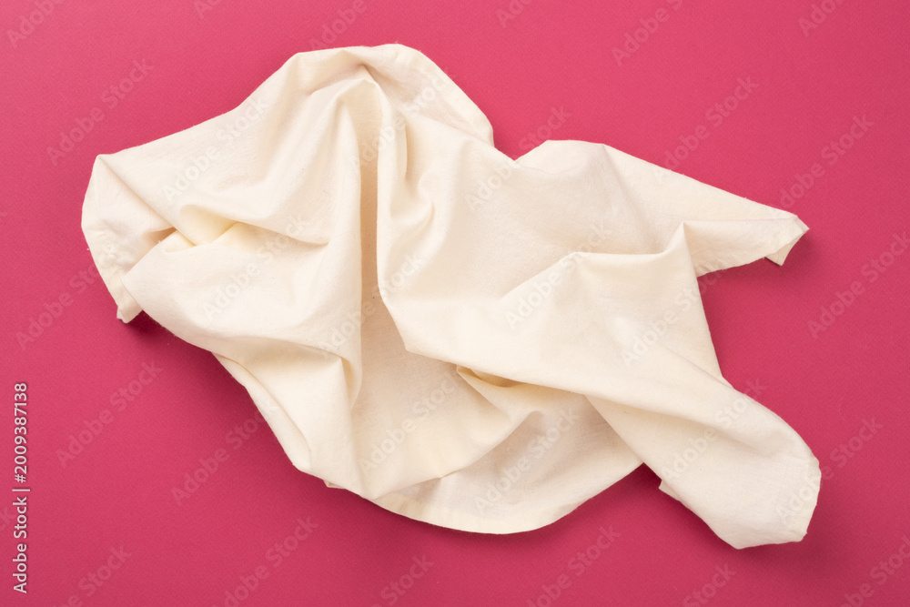 Fototapeta premium Kitchen napkin on color background, top view