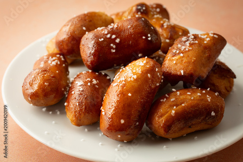 A view of a pile of dairy-free, gluten-free soft pretzel nuggets.