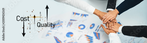 Slika na platnu A close-up view of multiple hands joined together, symbolizing teamwork and collaboration in a business context focused on cost and quality analysis for strategic growth