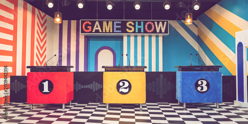 Colorful retro game show television studio with three numbered contestant podiums marquee sign and striped backdrop
