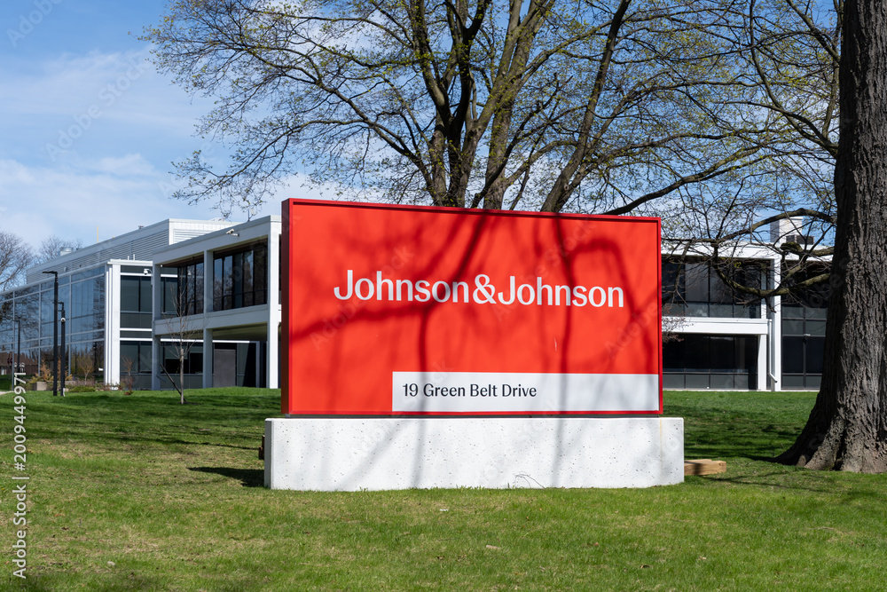 Fototapeta premium Toronto, Ontario, Canada - April 26, 2026: A Johnson and Johnson company ground sign in front of the building on Green Belt Drive in Toronto, Ontario. Johnson and Johnson is an American pharmaceutical
