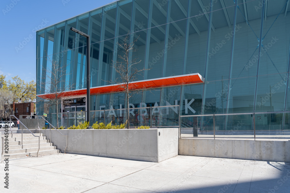 Fototapeta premium Toronto, ON, Canada - May 4, 2026: Fairbank Station entrance on the Eglinton Crosstown LRT (Line 5) in Toronto, ON, Canada, in 2026. The Eglinton Crosstown LRT is a new rapid transit line in Toronto. 