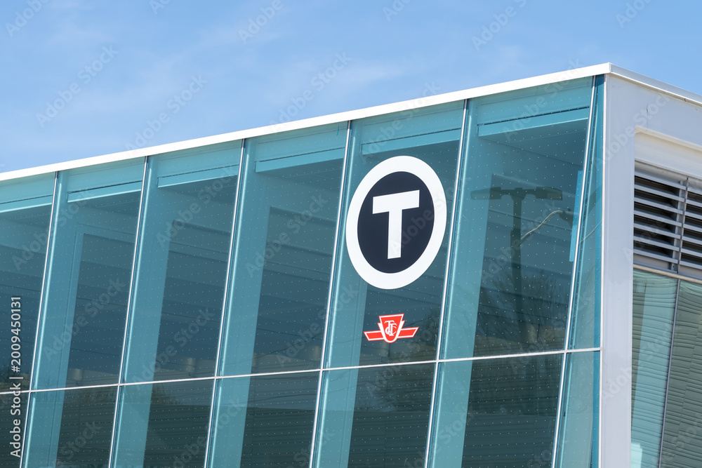 Obraz premium Toronto, ON, Canada - May 4, 2026: The ttc logo on the building at Mount Dennis Station on the Eglinton Crosstown LRT (Line 5) in Toronto. Mount Dennis Station is an intermodal terminal serving GO Tra