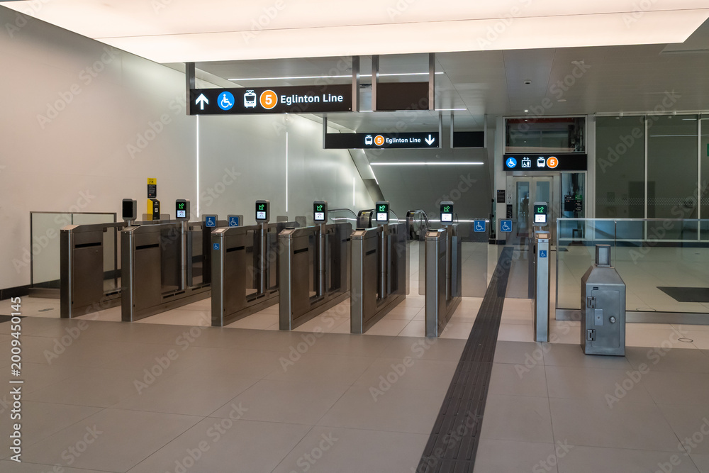 Fototapeta premium Toronto, ON, Canada - May 4, 2026: PRESTO readers at the fare gate in a station on the Eglinton Crosstown LRT (Line 5 Eglinton) in Toronto, ON, Canada, in 2026. The Eglinton Crosstown LRT is a new rap