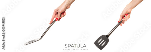 Female hand hold spatula. Isolated on a white background 