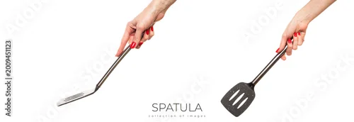 Panel kuchenny z motywem Female hand hold spatula. Isolated on a white background 