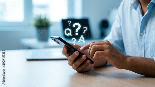 Person holds smartphone with digital Q&A symbols, representing online inquiry, problem-solving, and efficient information seeking via mobile technology