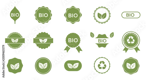 Collection of organic bio labels and badges with leaf and recycle symbols.