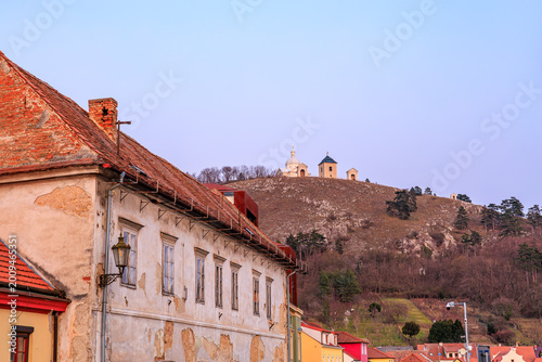Photos Historic european village with old architecture and hilltop chapels