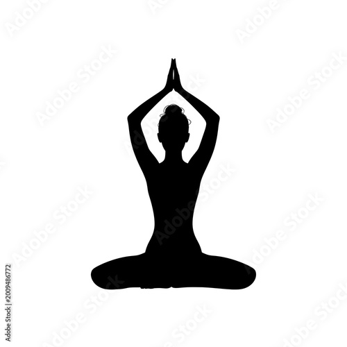 silhouette of a woman doing yoga