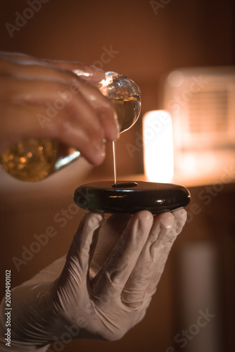 Canvas Print Essential oil on massage stone