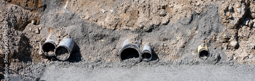 Fotografía Residential construction site, trench excavated for underground utilities, sand