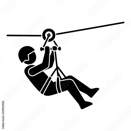 Fotografía Person riding zipline on a cable with safety gear attached to harness