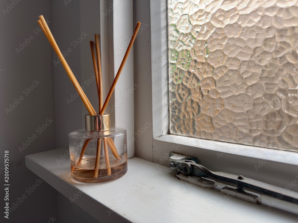 Fotografi diffuser on bathroom window sill