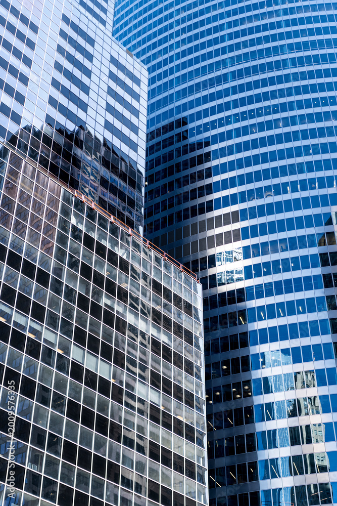 Fototapeta premium Architecture reflection. Building architecture. Building background. Glass building window. Architectural detail. Background of architecture. Modern glass background. Reflective glass background