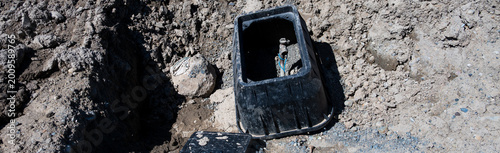 Slika na platnu Black Valve Box with newly installed water pipe coming out of ground, new reside