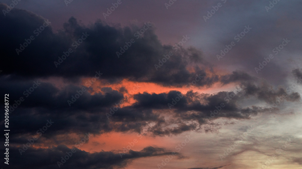 Obraz premium Dramatic Sunset Sky With Dark Clouds