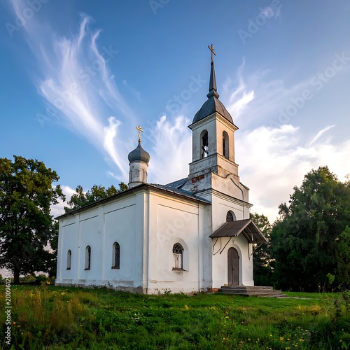 A serene white church with a tall steeple and dome