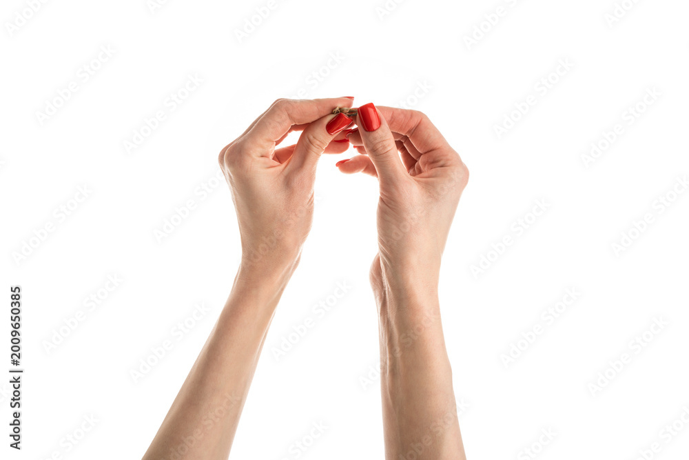 Fototapeta premium Female hand sunflower seeds on a white background isolation