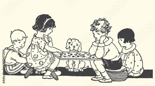 Fotografie Children and a dog playing a board game at a table with children childhood activ