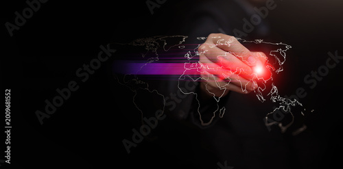 Hand with stylus pointing to glowing China on digital world map with arrow. Power shift from West to East. Rising Asian influence, geopolitical change, and economic realignment concept and strategy.