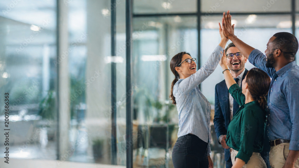 Obraz premium Diverse business team high five celebrating success