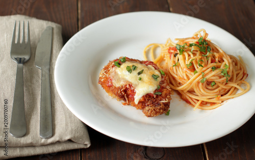 Chicken Parmesan. Breaded chicken breast with marinara sauce and spaghetti
