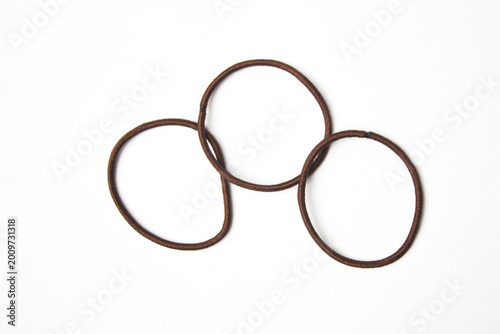 Brown hair ties on white background. Hair accessory