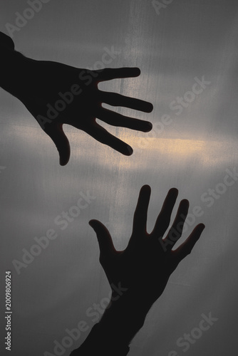 Konstfotografi Silhouette of male hands. Dark view