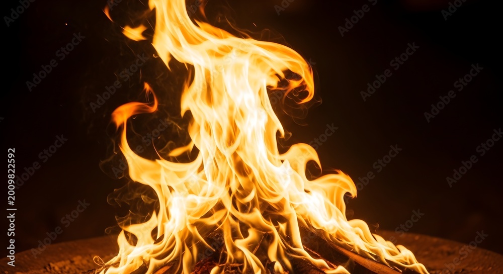 Fototapeta premium Intense flames rising a dramatic close up of a roaring fire at night