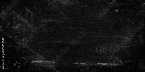 Photos A textured dark background with a pattern of scratches, perfect for adding depth and intrigue to your designs