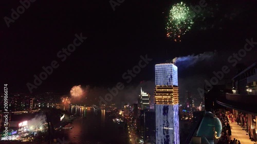 Ho Chi Minh City ,Vietnam 1st Jan, 2026 epic 4k video during night time of Saigon River skyline look from roof top of Sea Tower - fire work for new year eve