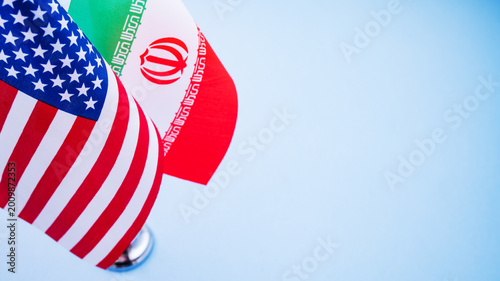 Φωτογραφία Flags of America and Iran close up isolated on background